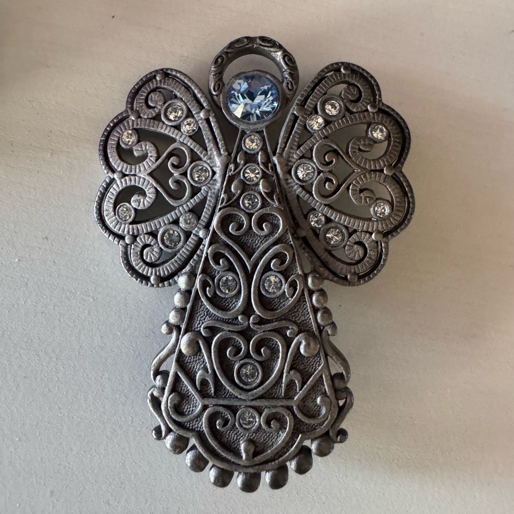 Intricate Silver Angel Brooch with Blue Gem